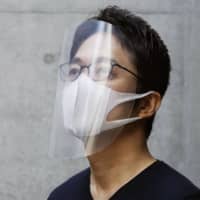 Olympic torch designer shares DIY face shield